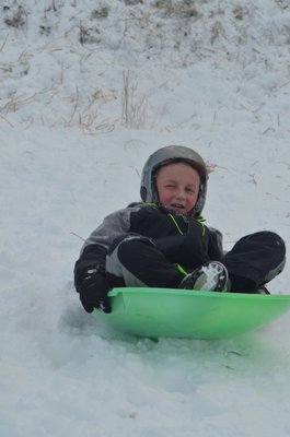 Sledding at Southampton Youth Services on Sunday afternoon.  KIM COVELL