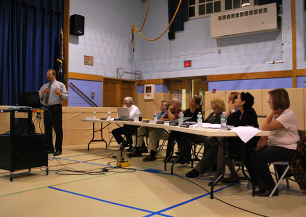 Architect Larry Salvesen presents an expansion plan to residents at a meeting on Monday.