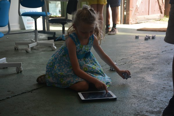 Campers learn how program robots. At the end of the week they will build their own using a robot kit.   COSETTE NUNEZ-VALAREZO