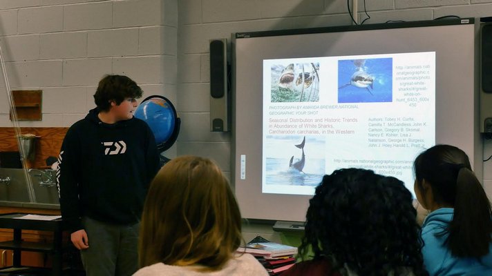 15-year-old Southampton freshman David Nichols presents some of his research about sharks to his classmates. COURTESY ANGELO BAIO