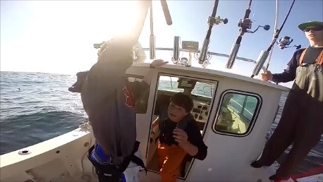 Fred Schneider, a senior at Southampton High School, gets ready to tag a shark. COURTESY OF LONG ISLAND SHARK COLLABORATION