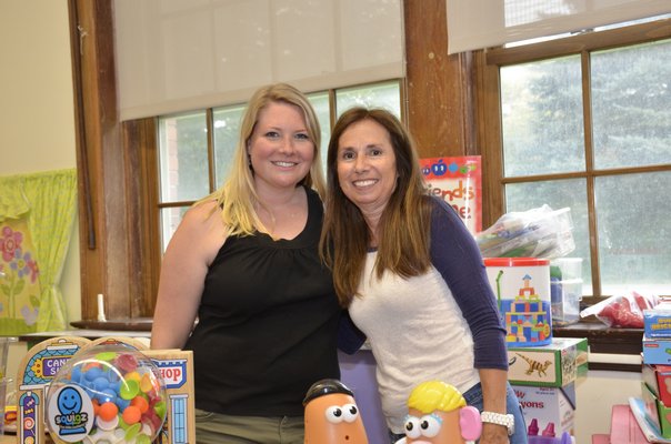 Kristen Stubelek, left, a pre-K teacher at Southampton Elementary School, and Annemarie Calogrias, a teacher's assistant, prepare their classroom for the 2017-18 school year. GREG WEHNER