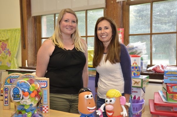 Kristen Stubelek, left, a pre-K teacher at Southampton Elementary School, and Annemarie Calogrias, a teacher's assistant, prepare their classroom for the 2017-18 school year. GREG WEHNER