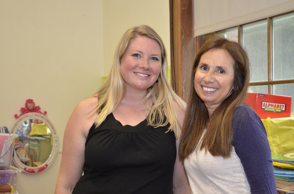 Kristen Stubelek, left, a pre-K teacher at Southampton Elementary School, and Annemarie Calogrias, a teacher's assistant, prepare their classroom for the 2017-18 school year. GREG WEHNER