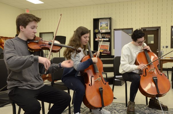 Robert McKnight, left, Valentina Kobler and Kivlan King are members of the Southampton High School orchestra. GREG WEHNER