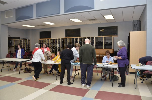 Southampton School election officials count absentee ballots after Tuesday's vote. GREG WEHNER