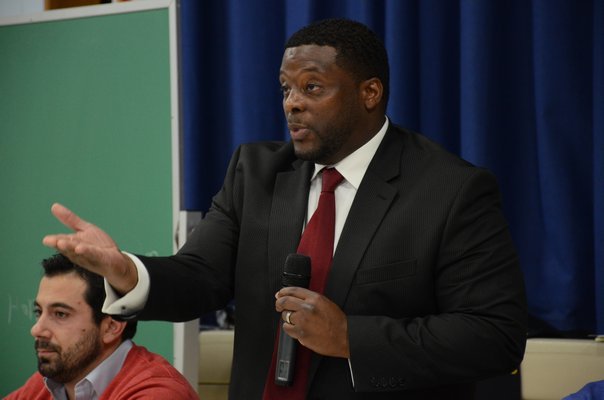 Southampton Town Housing Authority Chairman Curtis Highsmith speaks to Remsenburg and Speonk residents about a potential development in Speonk that will create 50 units of workforce housing. GREG WEHNER