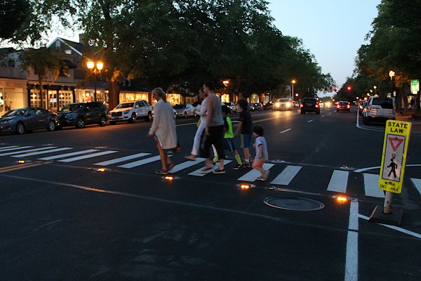 A lighted crosswalk, like the one on Main Street in East Hampton, will be coming to Brdgehampton Main Street this fall.    KYRIL BROMLEY