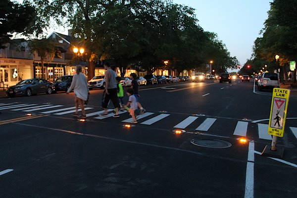 A lighted crosswalk, like the one on Main Street in East Hampton, will be coming to Brdgehampton Main Street this fall.    KYRIL BROMLEY