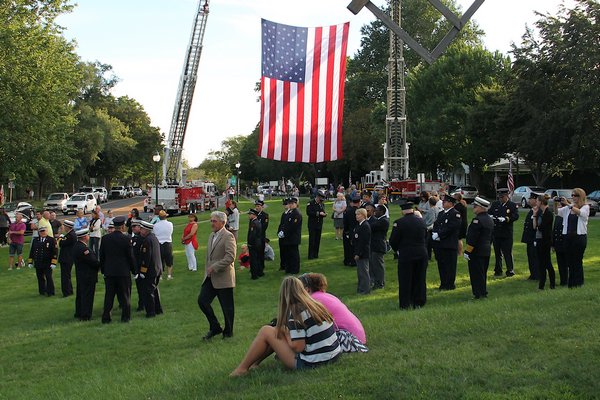Supervisor Larry Cantwell and East Hampton Village Mayor Paul Rickenbach were joined by fire officials at the September 11 memorial at the Hook Mill in East Hampton on Sunday. KYRIL BROMLEY