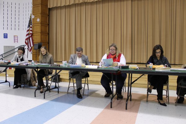 From left, East Quogue Board of Education members Diana Gobler, Carrie Bender, Superintendent Les Black, and board members Kathryn Tureski and Patricia Tuzzolo during a recent board meeting. KYLE CAMPBELL