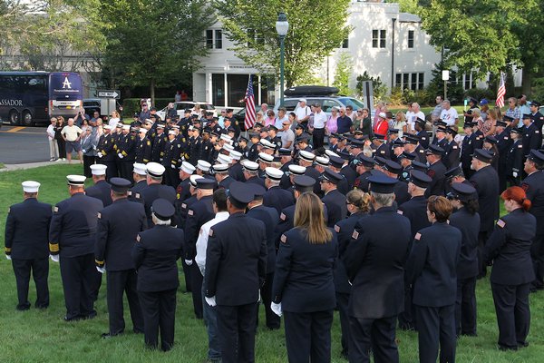 Supervisor Larry Cantwell and East Hampton Village Mayor Paul Rickenbach were joined by fire officials at the September 11 memorial at the Hook Mill in East Hampton on Sunday. KYRIL BROMLEY