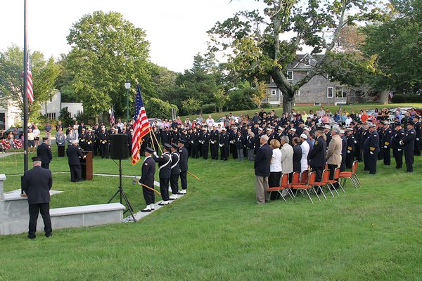 Supervisor Larry Cantwell and East Hampton Village Mayor Paul Rickenbach were joined by fire officials at the September 11 memorial at the Hook Mill in East Hampton on Sunday. KYRIL BROMLEY