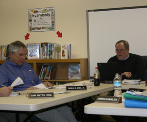 Remsenburg/Speonk School Board Member Thomas Kerr, left, with School Board President Jeremiah Collins at the district's board of education meeting Monday night. JESS