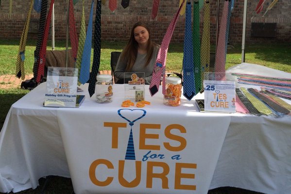 Ross School student Dillon Kab at a "Ties for a Cure" stand, part of her senior project to create non-profit organizations. Photo courtesy Lauren Carrozzi.