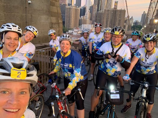 Kim Covell, bottom left, and her Flying Point team on the Brooklyn Bridge on Friday morning.