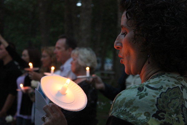 Geralyn Sagar, of Southampton, blows out a candle during vigil held for Cameron Nicholls, who she said she considered to be another one of her sons. CAROL MORAN