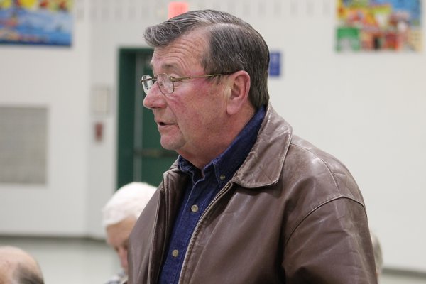 East Quogue resident and Air Force veteran John Barron  speaks in favor of a tax exemption for veterans in the East Quogue School District during a public hearing held by the district's board of education Tuesday night. KYLE CAMPBELL