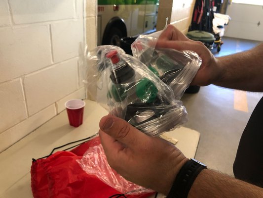 Daniel Foisset compares two of the three oxygen masks, which are designed to be used on small to large sized pets. VALERIE GORDON
