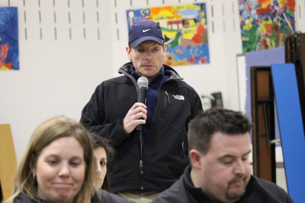 East Quogue resident Joe Amato speaks in favor of piercing the state tax levy cap during a budget presentation at East Quogue Elementary School on Tuesday night. KYLE CAMPBELL