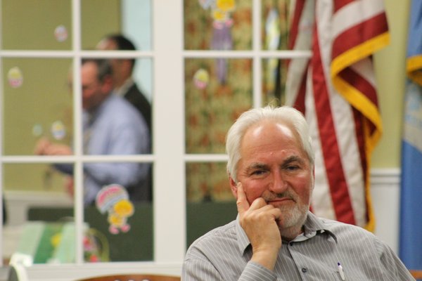 Hampton Bays Civic Association Vice President Bruce King watches as Hampton Bays School District officials present an out line of their upcoming budget on Monday evening. KYLE CAMPBELL
