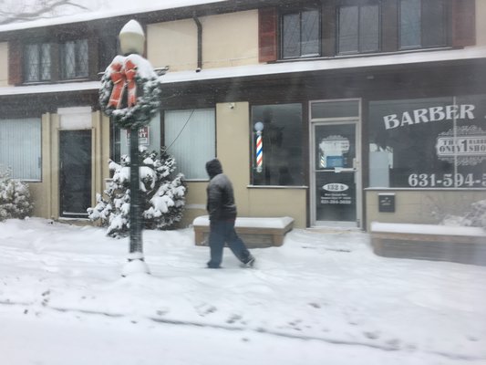 Hampton Bays in the snow on Saturday. DANA SHAW