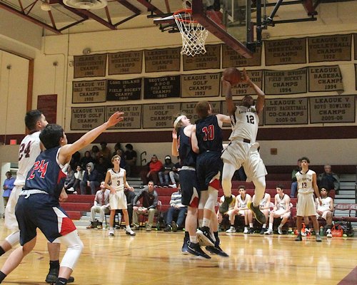 East Hampton's Jeremy Vizcaino attempts a shot from an awkward angle. KYRIL BROMLEY
