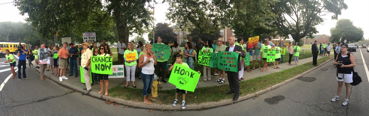 About 65 people protested in front of the Westhampton Beach Middle School on Wednesday morning in support of Aiden Killoran.  DANA SHAW