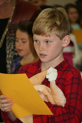 Fourth-grader Christopher Czerwinski at the Remsenburg-Speonk Thanksgiving assembly. BY ERIN MCKINLEY