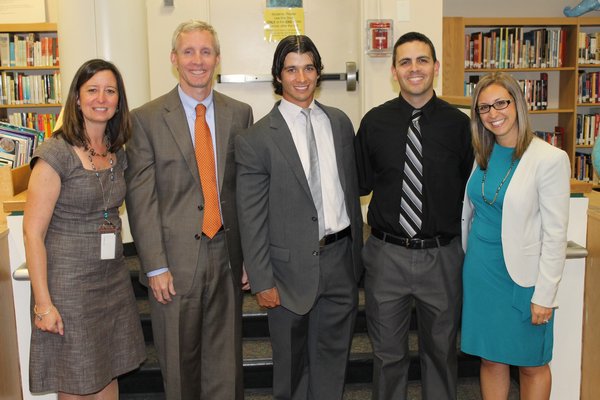 From left, Westhampton Beach Elementary School Principal Lisa Slover, Assistant Superintendent for Personnel and Instruction William Fisher, health education teacher Cody Hoyt, science teacher Gregory Izzo and math teacher Vanessa Tucker all were honored for receiving tenure during the Westhampton Beach Board of Education meeting Monday night. KYLE CAMPBELL