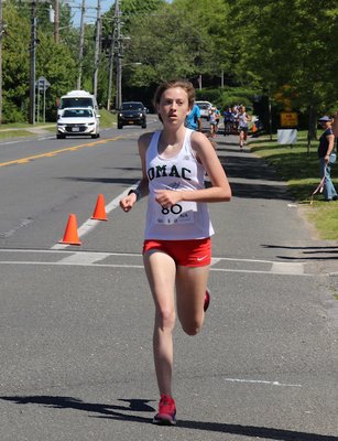 Ava Engstrom was the first to cross the finish line of the women's Montauk Mile on Sunday morning. KYRIL BROMLEY