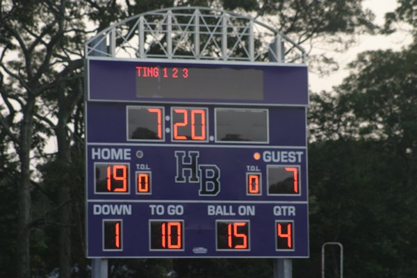 The recently installed score board on the football field outside Hampton Bays High School during a junior varsity football game Tuesday. The scoreboard is part of phase one of the district's $16.8 million bond project. KYLE CAMPBELL