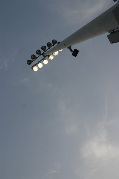 Newly installed lights illuminate the new synthetic turf football field at Hampton Bays High School during a junior varsity football game Tuesday. Both the lights and the field were part of phase one of the district's $16.8 million bond project. KYLE CAMPBELL