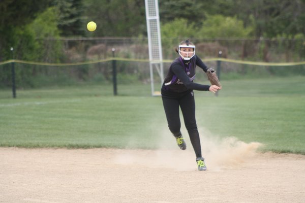 Shortstop Amelia Kozuchowski makes a throw in her team's 4-3 playoff win over Miller Place. CAILIN RILEY