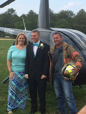 From left, Yvonne, Nick and Sal D'Amato. Nick few to the Eastport South Manor Senior Prom in an R-44 helicopter. COURTESY NICK D'AMATO
