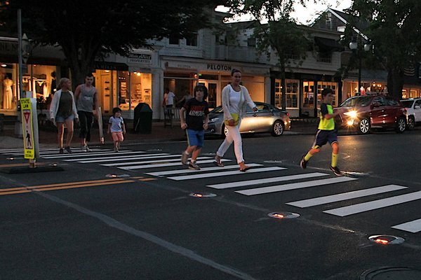 A lighted crosswalk, like the one on Main Street in East Hampton, will be coming to Brdgehampton Main Street this fall.    KYRIL BROMLEY