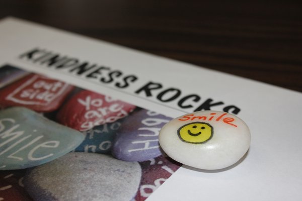 Students paint kindness rocks with positive messages. VALERIE GORDON