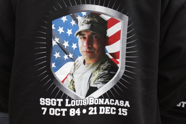 Bonacasa family members wear a sweatshirt with a photo of Louis printed on the back. VALERIE GORDON