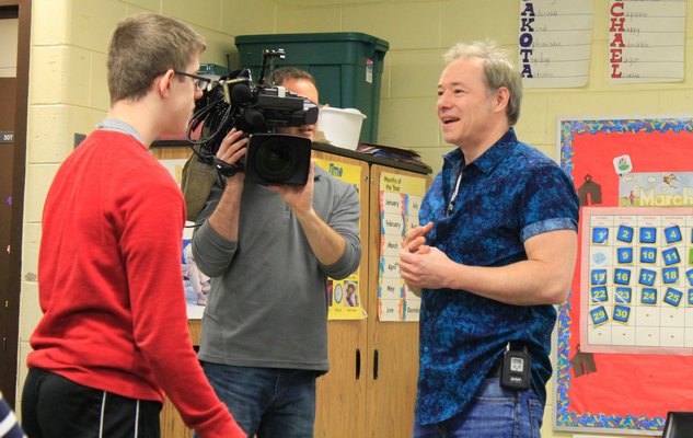 Joseph, a student in the Westhampton Beach Learning Center's student newspaper class, asks acclaimed children's musician Brady Rymer a question on Monday morning. KYLE CAMPBELL