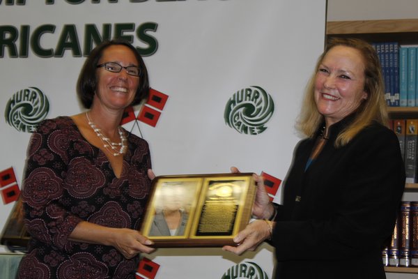 Westhampton Beach High School Board of Education President Suzanne Mensch honors Ms. Lee Cuthbert Green as one of the 2016-2017 Wall of Fame inductees. KATE RIGA
