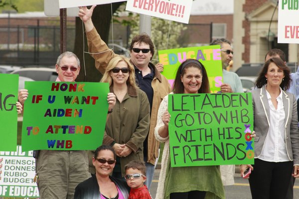 Picketers gathered outside Westhampton Beach Middle School to petition the Westhampton Beach Board of Education to allow Aiden Killoran, a Remsenburg-Speonk student with Down Syndrome, to attend the middle school next year. KYLE CAMPBELL