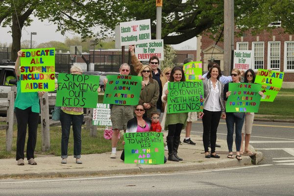 Picketers gathered near the intersection of Mill Road and Oneck Lane in Westhampton Beach on Monday afternoon to advocate for more special education programs in the Westhampton Beach School District.\ KYLE CAMPBELL