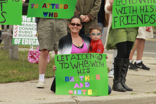 Picketers gathered near the intersection of Mill Road and Oneck Lane in Westhampton Beach on Monday afternoon to advocate for more special education programs in the Westhampton Beach School District.\ KYLE CAMPBELL