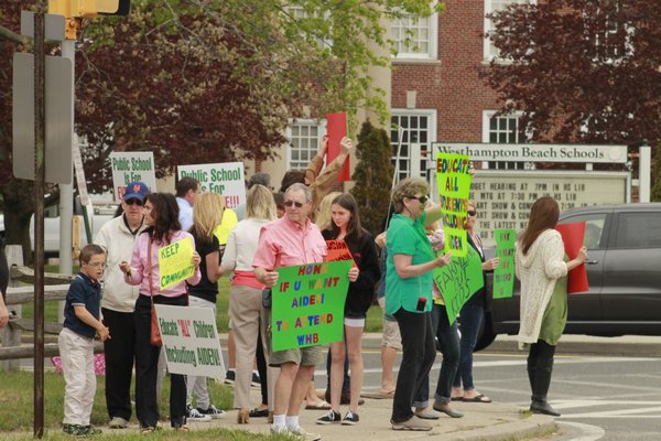 Picketers gathered near the intersection of Mill Road and Oneck Lane in Westhampton Beach on Monday afternoon to advocate for more special education programs in the Westhampton Beach School District.\ KYLE CAMPBELL