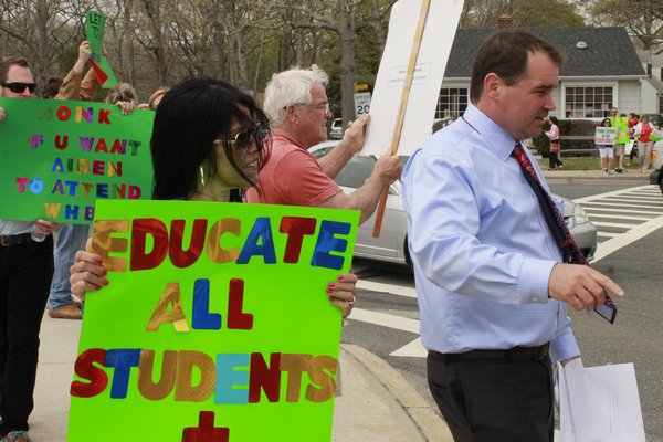 Picketers gathered near the intersection of Mill Road and Oneck Lane in Westhampton Beach on Monday afternoon to advocate for more special education programs in the Westhampton Beach School District.\ KYLE CAMPBELL