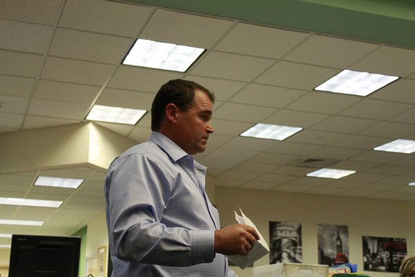 Remsenburg resident Christian Killoran speaks to the Westhampton Beach Board of Education on Monday night. Mr. Killoran, who was joined by roughly 40 supporters, urged the board to commit to creating a program for alternately assessed special needs students. KYLE CAMPBELL