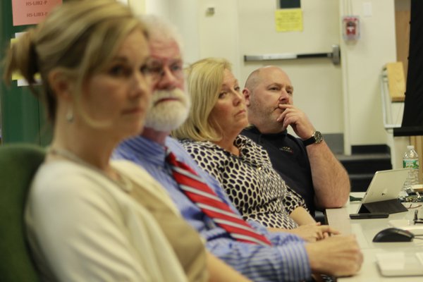 From left, Westhampton Beach Assistant Superintendent Kathleen O'Hara, School Board member Jim Hulme, School Board member Claire Bean and School Board member Bryan Dean listen to Remsenburg resident Christian Killoran's requests for additional special education programs in the district's middle and high schools. KYLE CAMPBELl