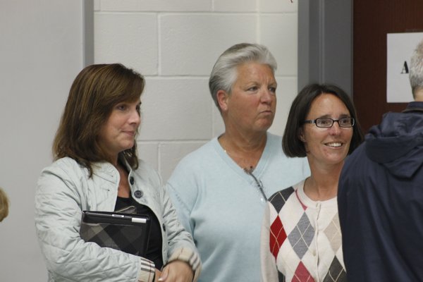 From left, Westhampton Beach School Board candidates Stacy Rubio, Joyce Donneson and Suzanne Mensch wait for votes totals to come in on Tuesday night. KYLE CAMPBELL