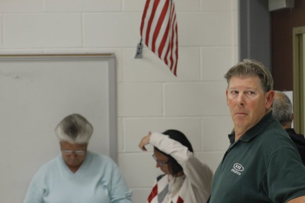 From left, Westhampton Beach School Board candidates Joyce Donneson, Suzanne Mensch and Steve Wisnoski wait for results to come in Tuesday night. KYLE CAMPBELL