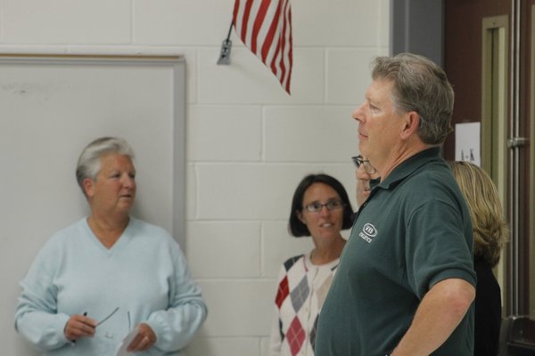 From left, Westhampton Beach School Board candidates Joyce Donneson, Suzanne Mensch and Steve Wisnoski wait for results to come in Tuesday night. KYLE CAMPBELL